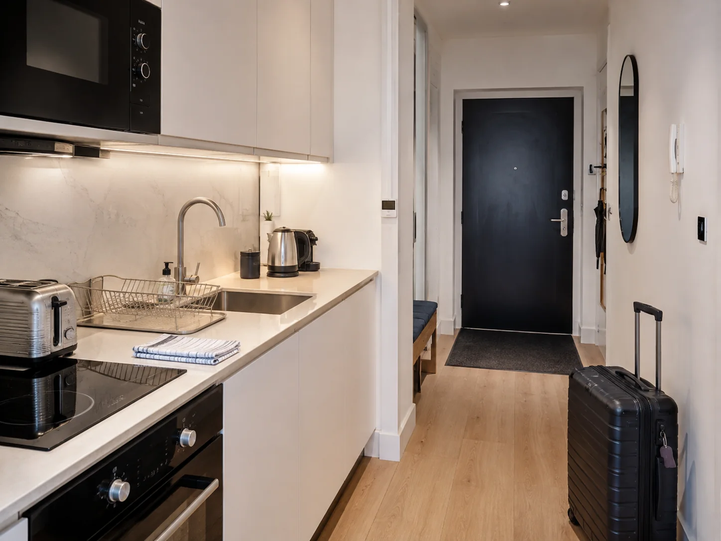 Spotless Airbnb kitchen and clear guest arrival area in a Paddington apartment